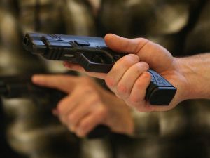 holding-gun-Getty-640x480